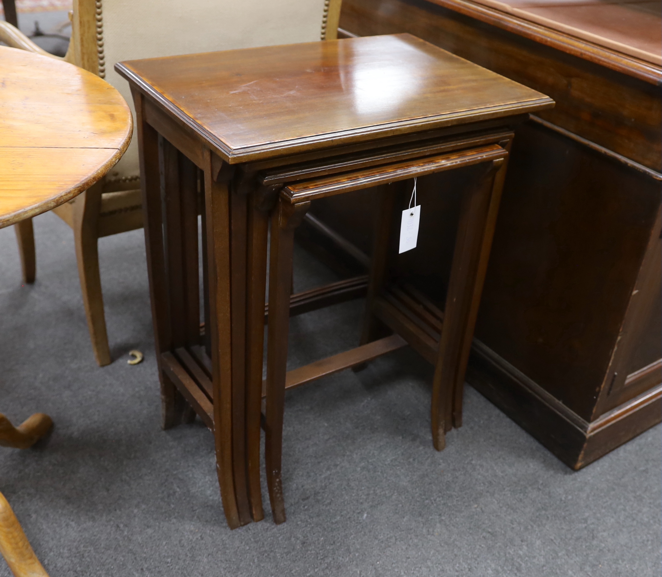 A quartetto of rectangular Edwardian satinwood banded mahogany tea tables, width 56cm, depth 37cm, height 70cm